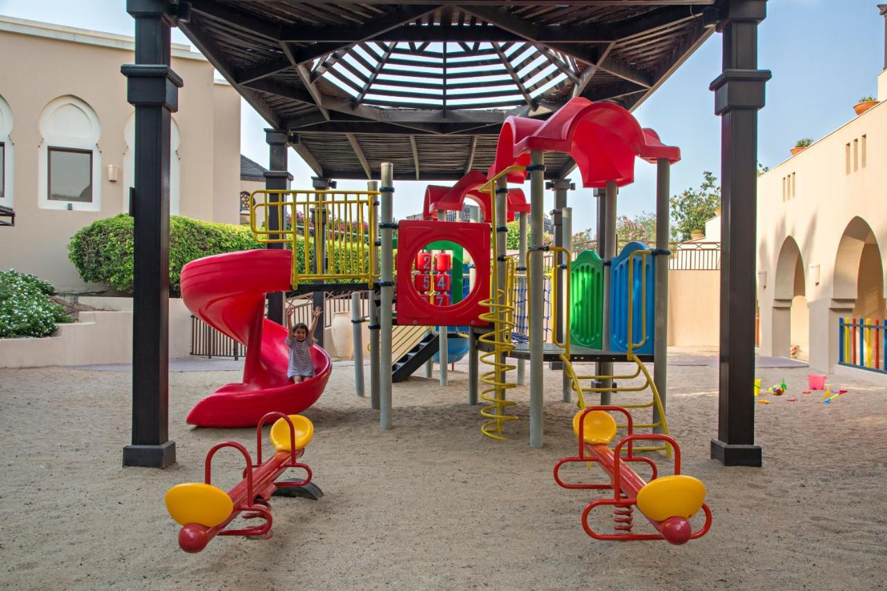 Miramar Al Aqah Beach Resort Extérieur photo Playground at the school